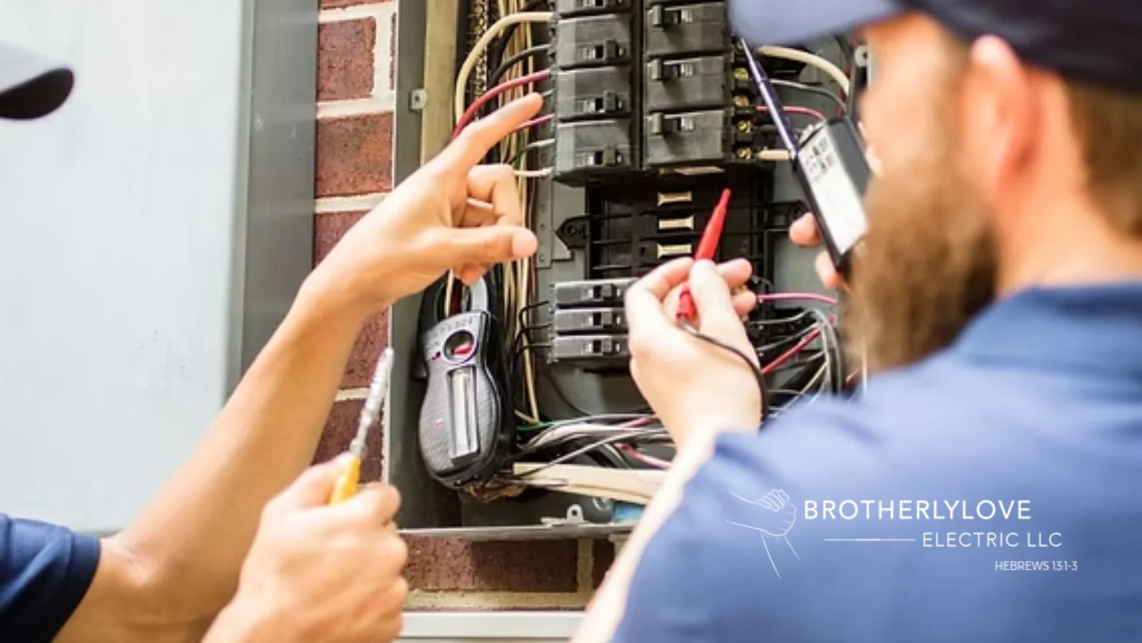 Master electrician inspecting a residential electrical panel in The Woodlands before hurricane season and summer grid demand